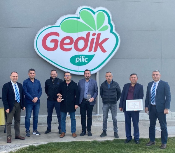 Gedlick team members with the Platinum 155 Club certificate