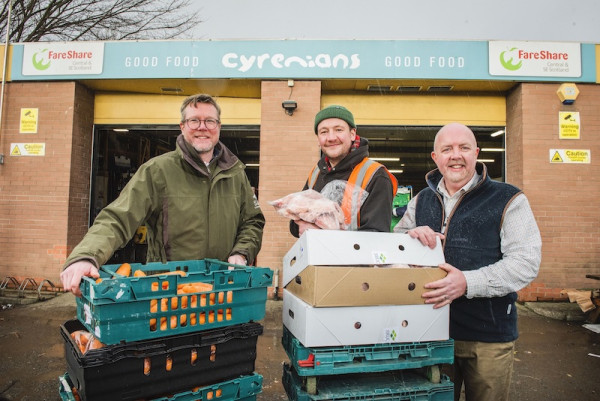 Team with food boxes at FareShare facility